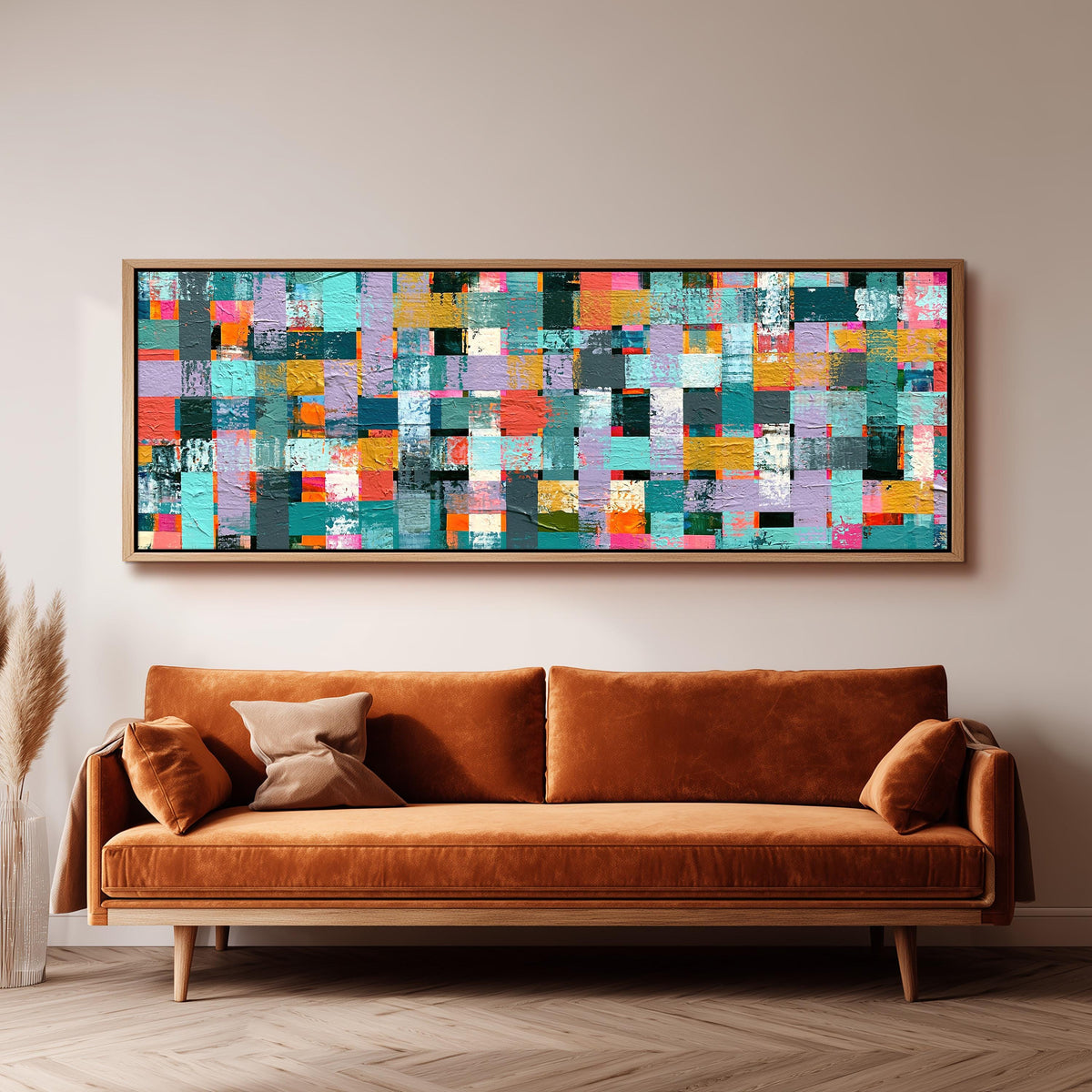 Woven grid of teal and pink blocks panoramic canvas print above a sofa in a living room
