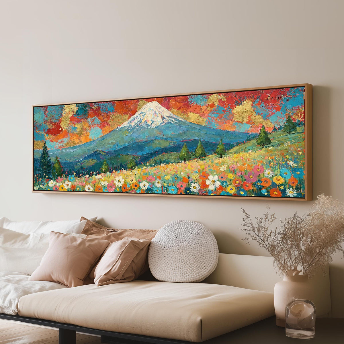 Mount Fuji under a red and gold sunset sky panoramic canvas print above a sofa in a living room