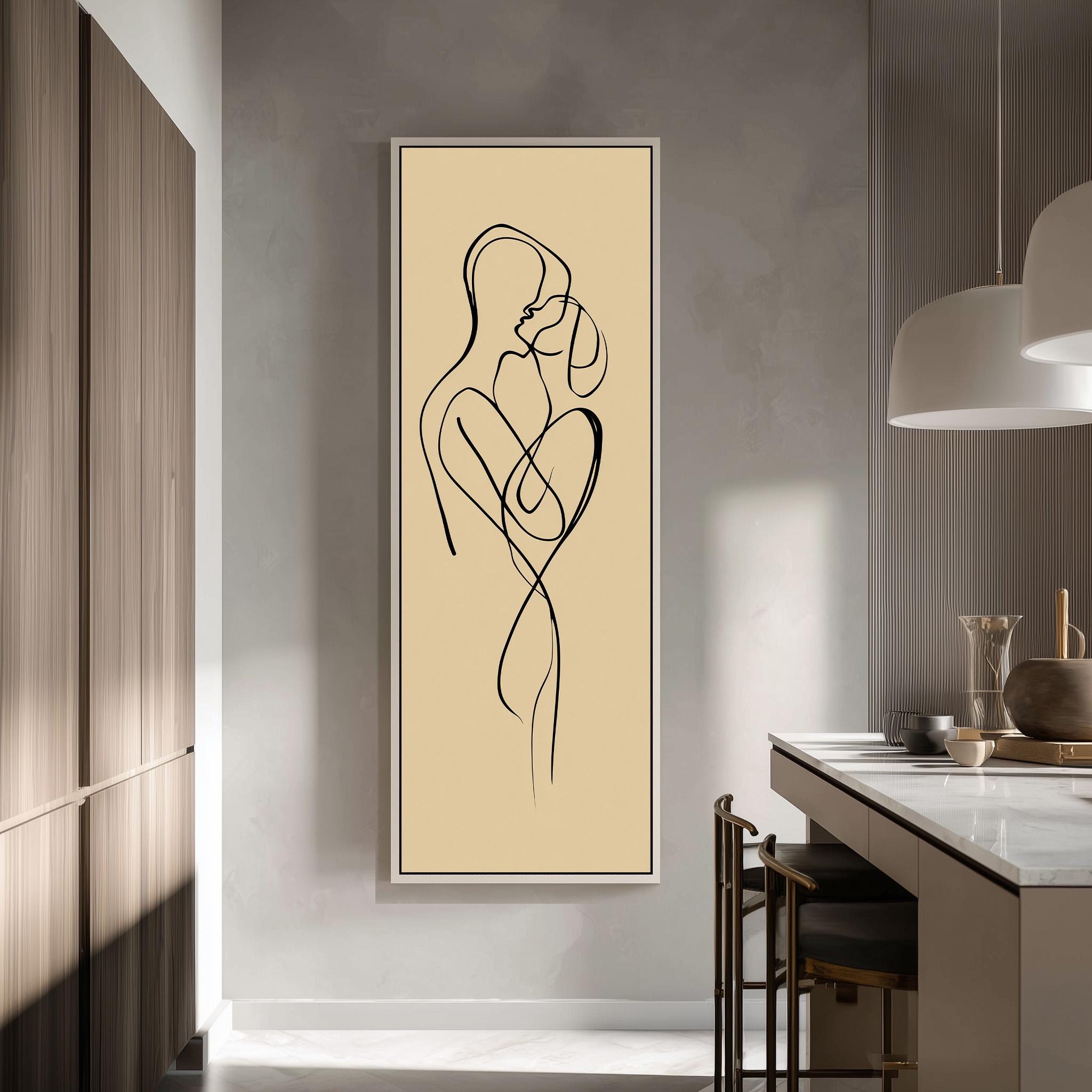 a modern kitchen with a minimalist design. The focal point is a large abstract drawing of a couple embracing, which is displayed on the wall above a kitchen counter. The kitchen counter has a few items on it, including a vase and a bowl. The overall color scheme of the kitchen is neutral, with a beige wall and wooden cabinets.