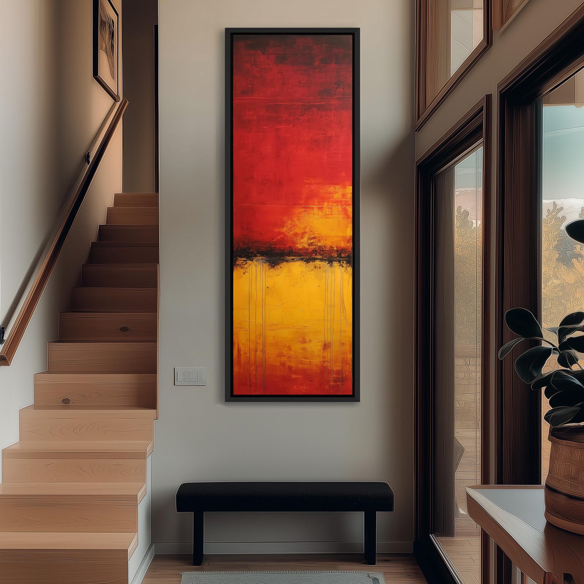 a modern interior design with a large abstract painting hanging on the wall above a black bench. The painting has a vibrant red and yellow color scheme, creating a striking focal point in the space. The room also includes a staircase, a potted plant, and a window, contributing to the overall aesthetic and atmosphere of the space.