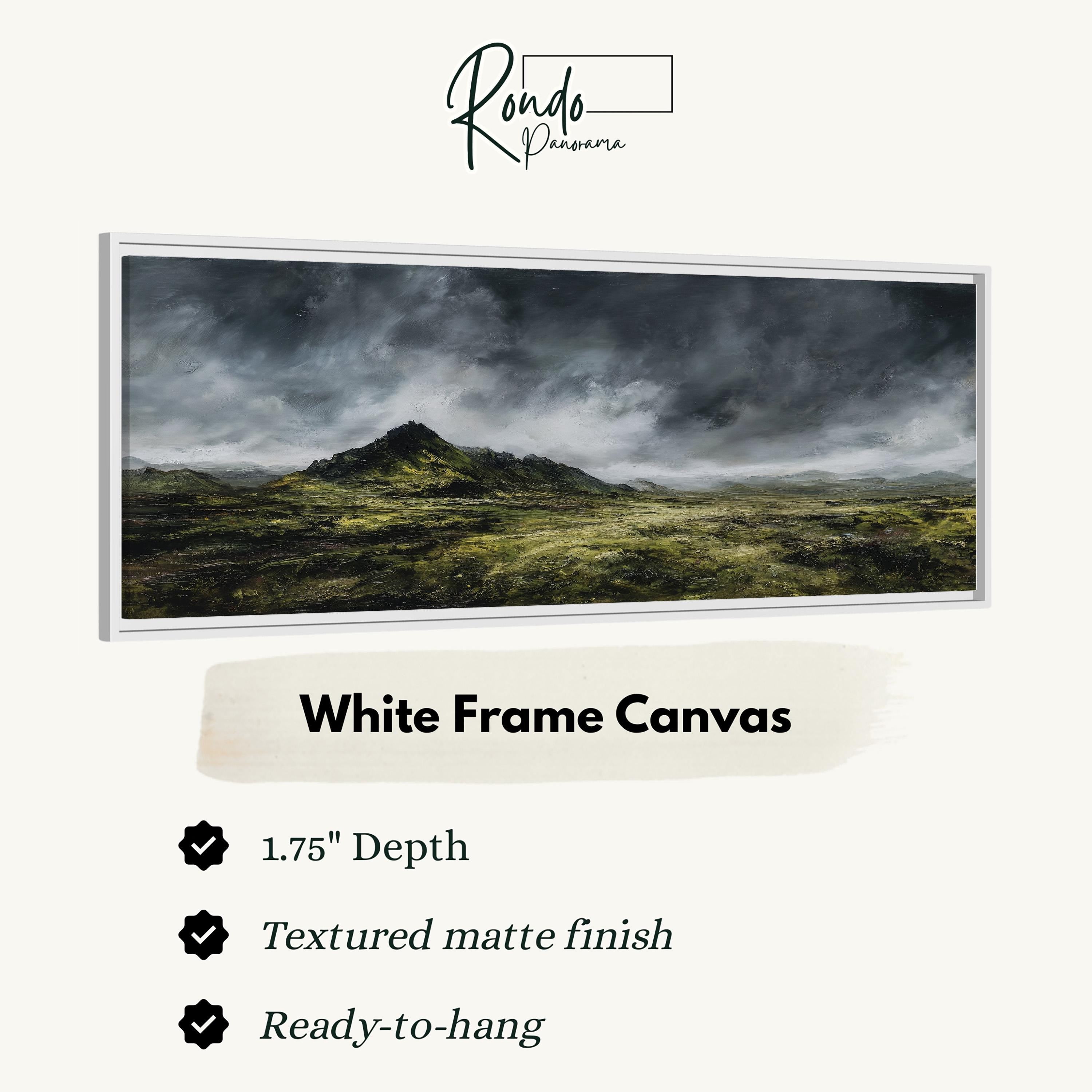 The image is a white frame canvas depicting a landscape with a mountain in the background and a cloudy sky above.
