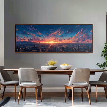 a large, framed painting of a cityscape with a colorful sunset over the city skyline. The painting is hung on a wall above a wooden dining table with four chairs. The table is set with a bowl of fruit and a vase of flowers, creating a cozy and inviting atmosphere.