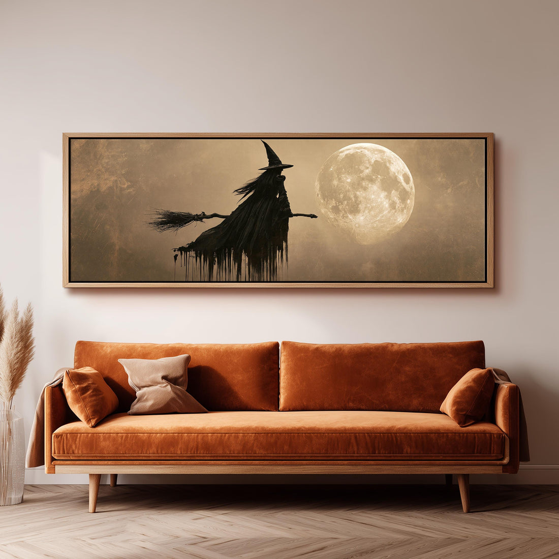Witch on a broomstick before a full moon long horizontal canvas print above a sofa in a living room
