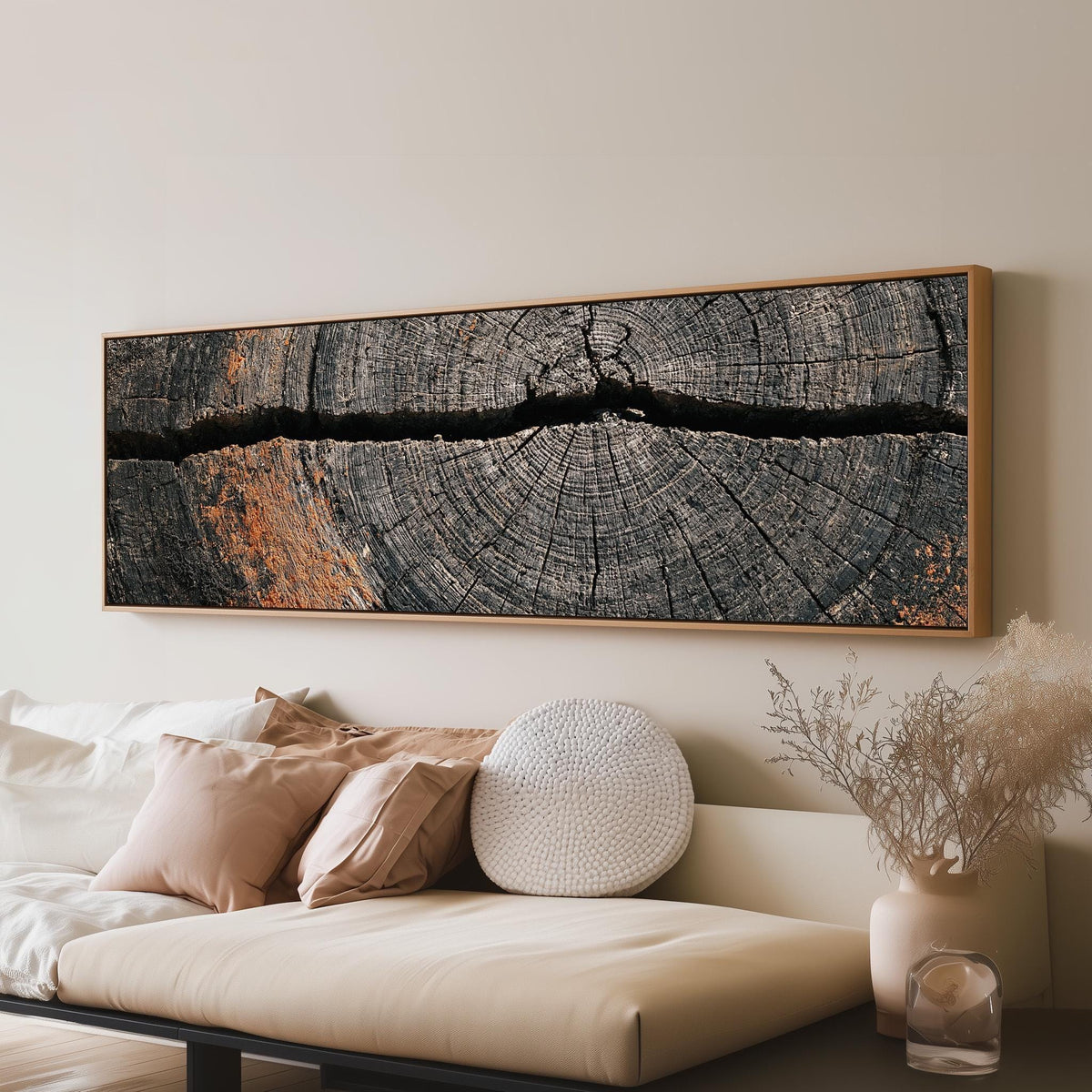 Cracked weathered wood ring long horizontal canvas print above a sofa in a living room