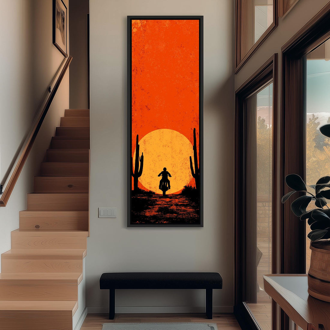 a large, vibrant painting of a desert scene with a cactus and a motorcycle, hanging on the wall of a hallway.