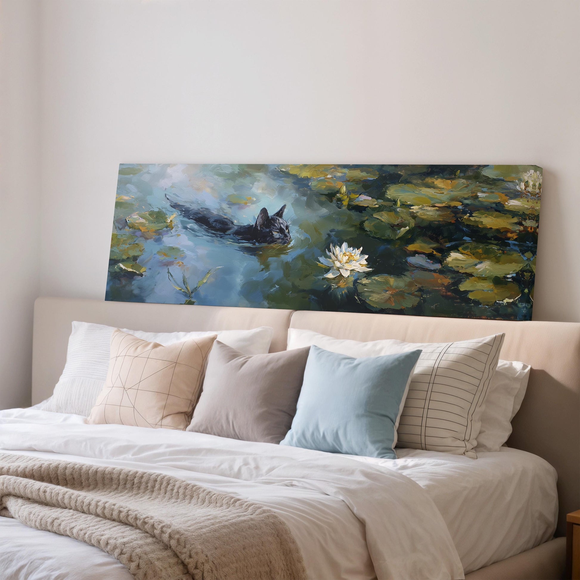 a large painting of a cat swimming in a pond with lily pads, hanging on a wall above a bed with white bedding and pillows.