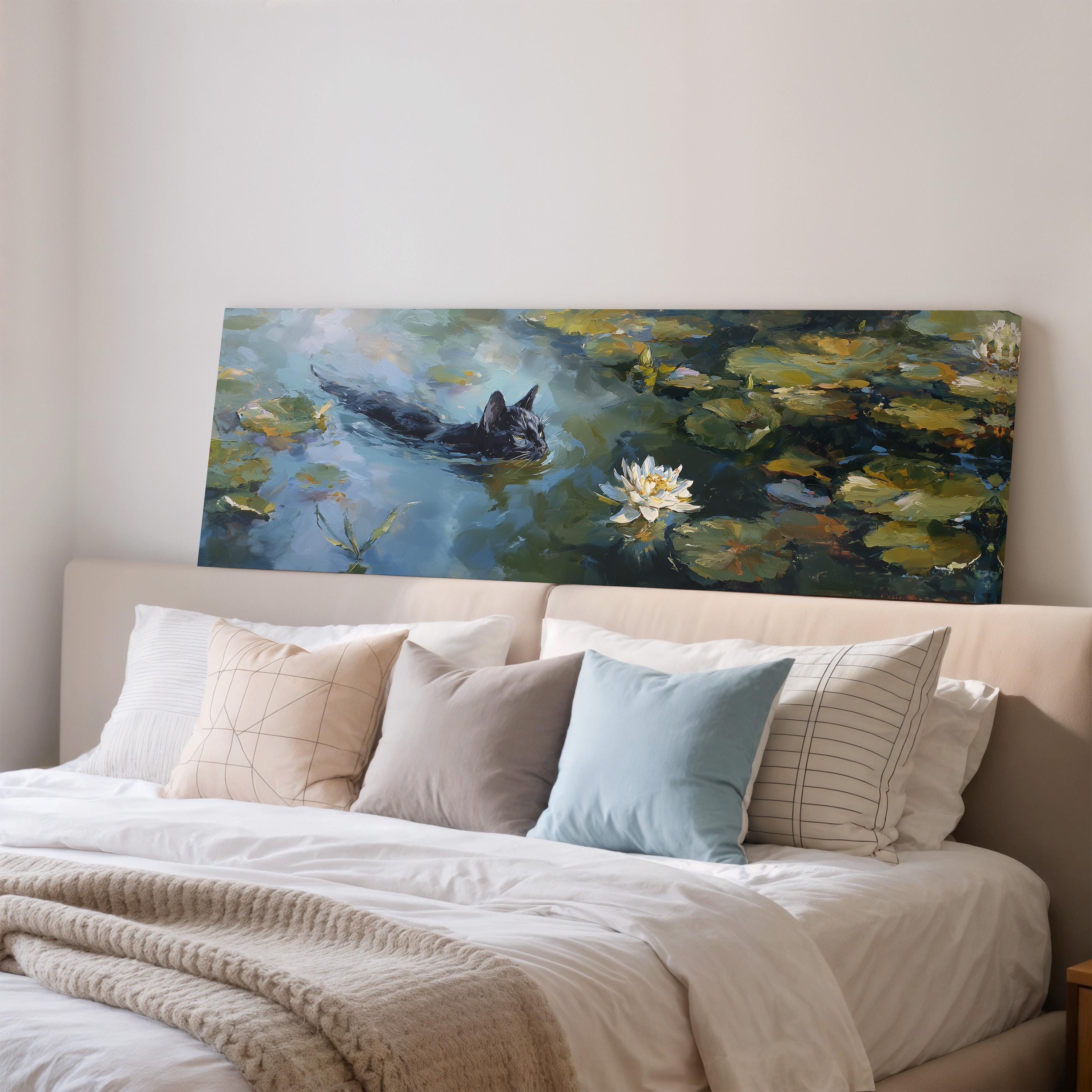 a large painting of a cat swimming in a pond with lily pads, hanging on a wall above a bed with white bedding and pillows.