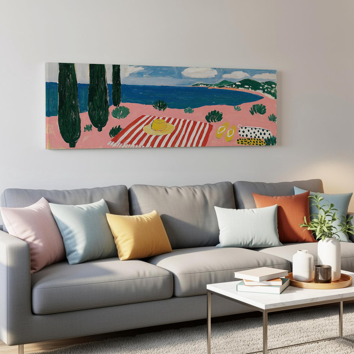 Mediterranean beach day with a striped towel panoramic canvas print above a grey sofa in a living room