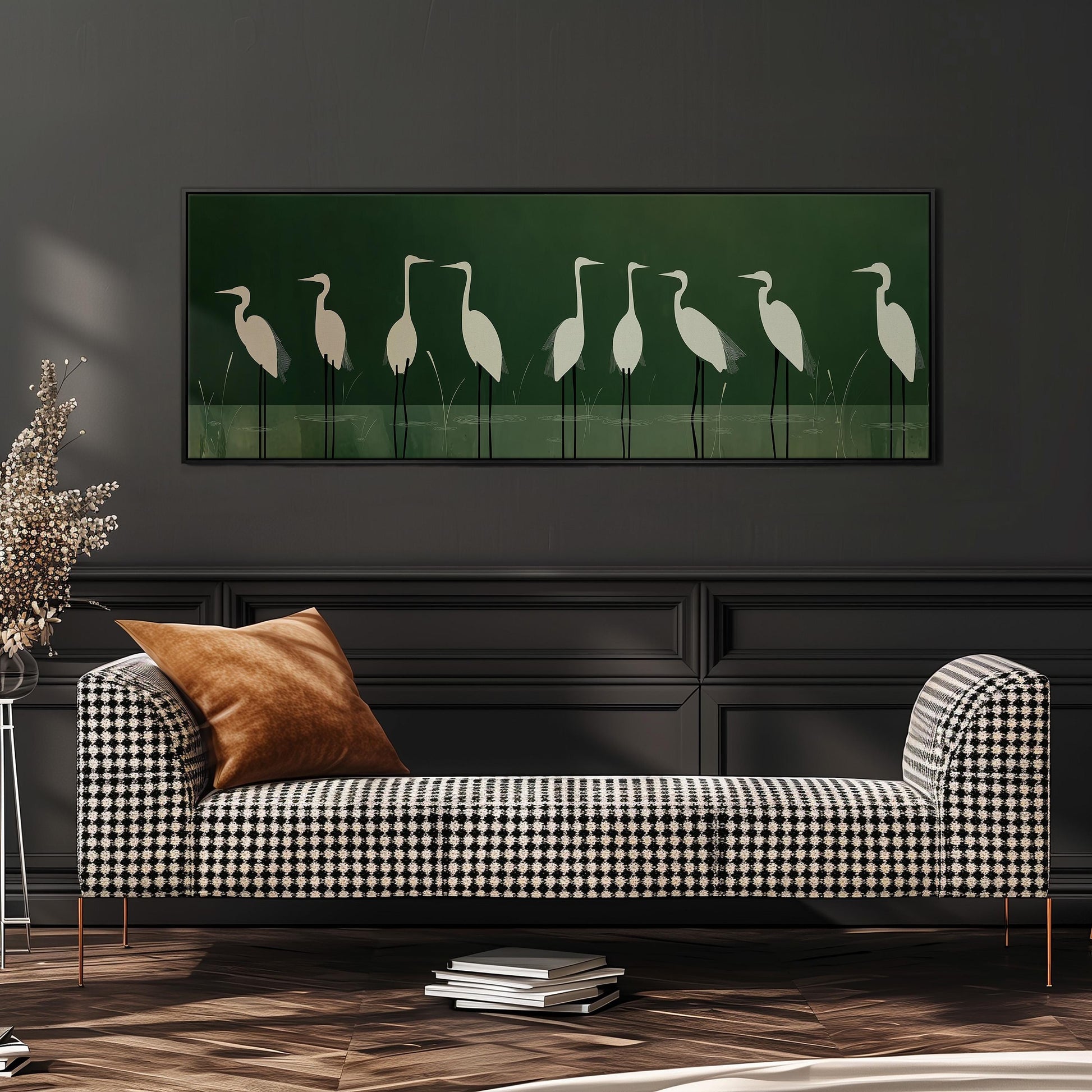 a black and white checkered sofa with a brown throw pillow, set against a dark wall with a framed artwork of white birds on the wall above it.