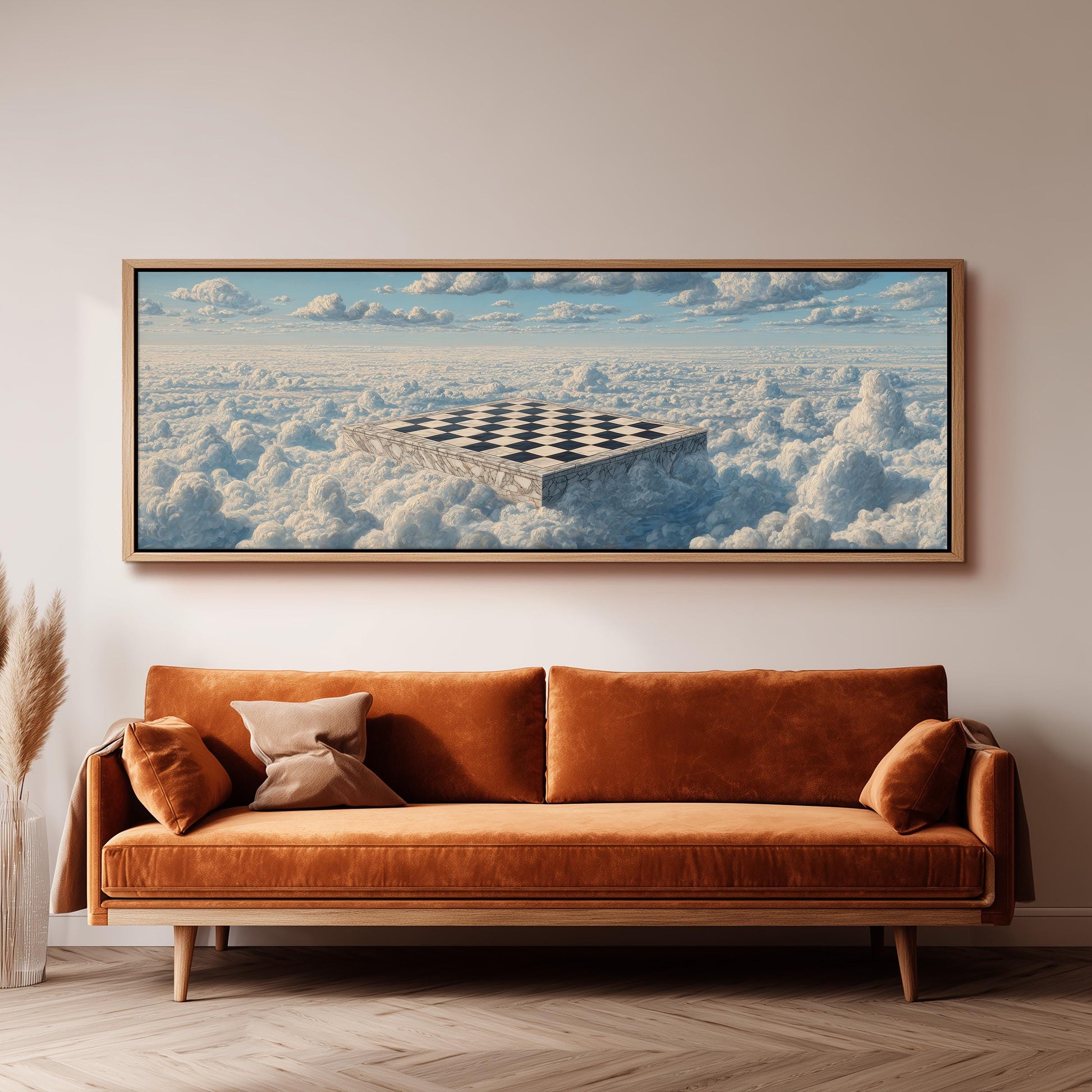 a large, rectangular painting hanging on a wall above a brown sofa.