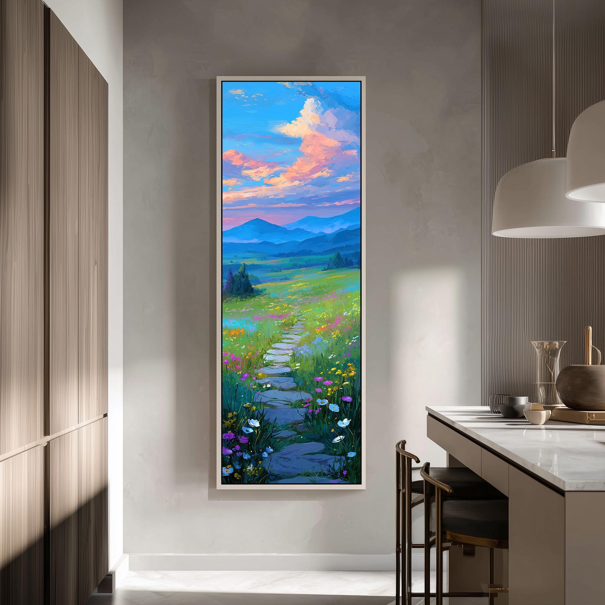 a large, colorful painting of a winding path leading through a lush, flower-filled field, with mountains in the distance. The painting is hung on a wall in a modern kitchen, creating a harmonious blend of nature and contemporary design.