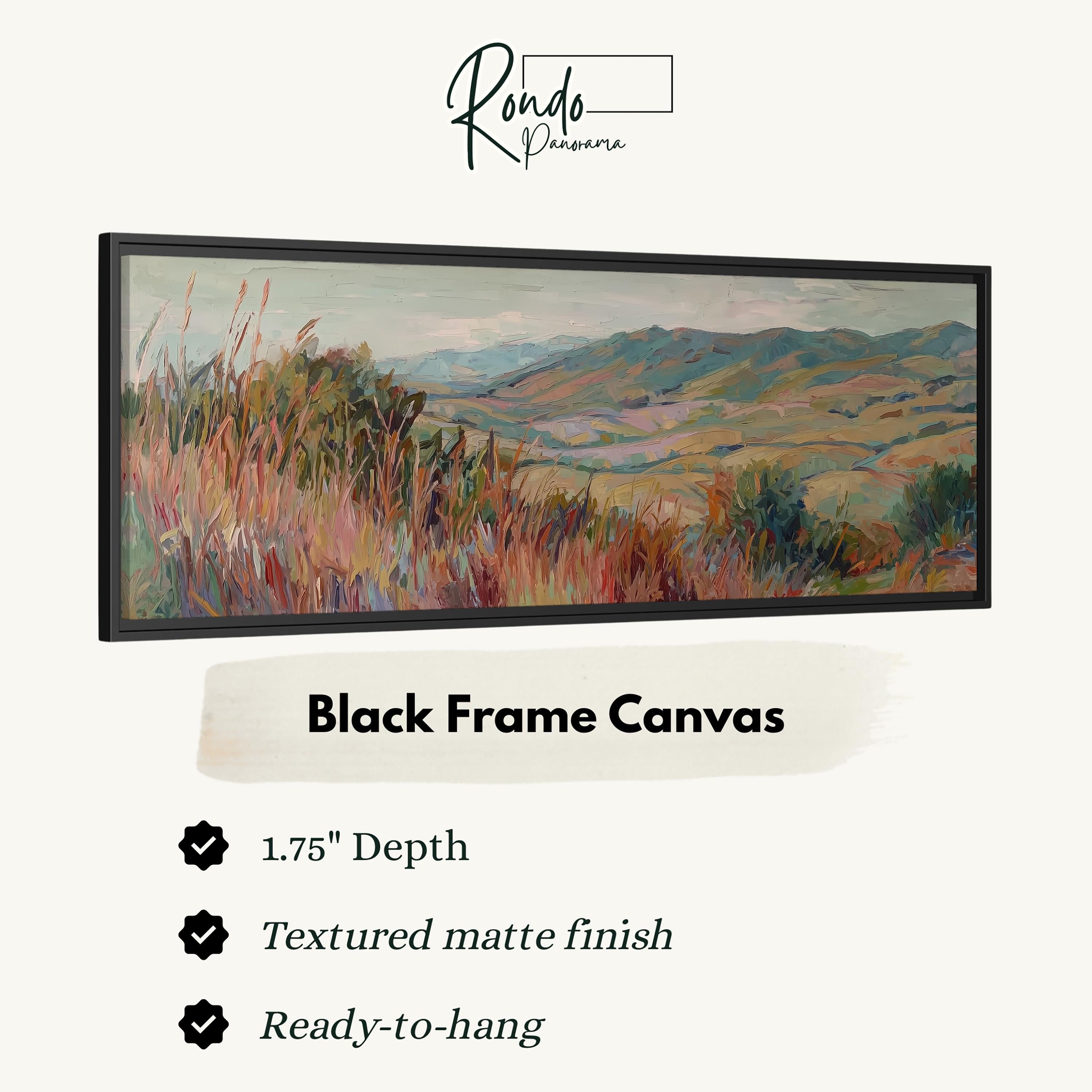 The image is a black frame canvas depicting a landscape with mountains and grassy fields.
