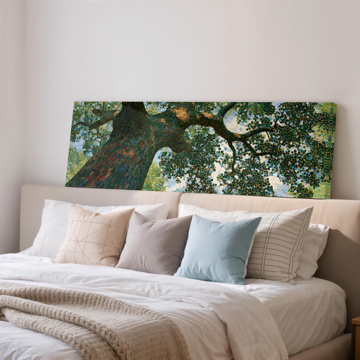 Looking up into an oak canopy wide panoramic canvas print above a bed in a bedroom
