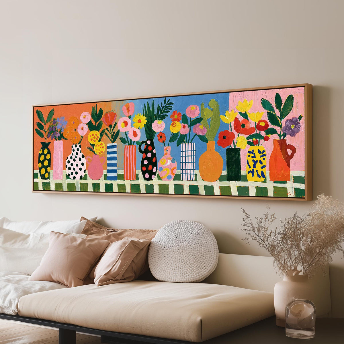 Patterned vases with bright bouquets panoramic canvas print above a sofa in a living room