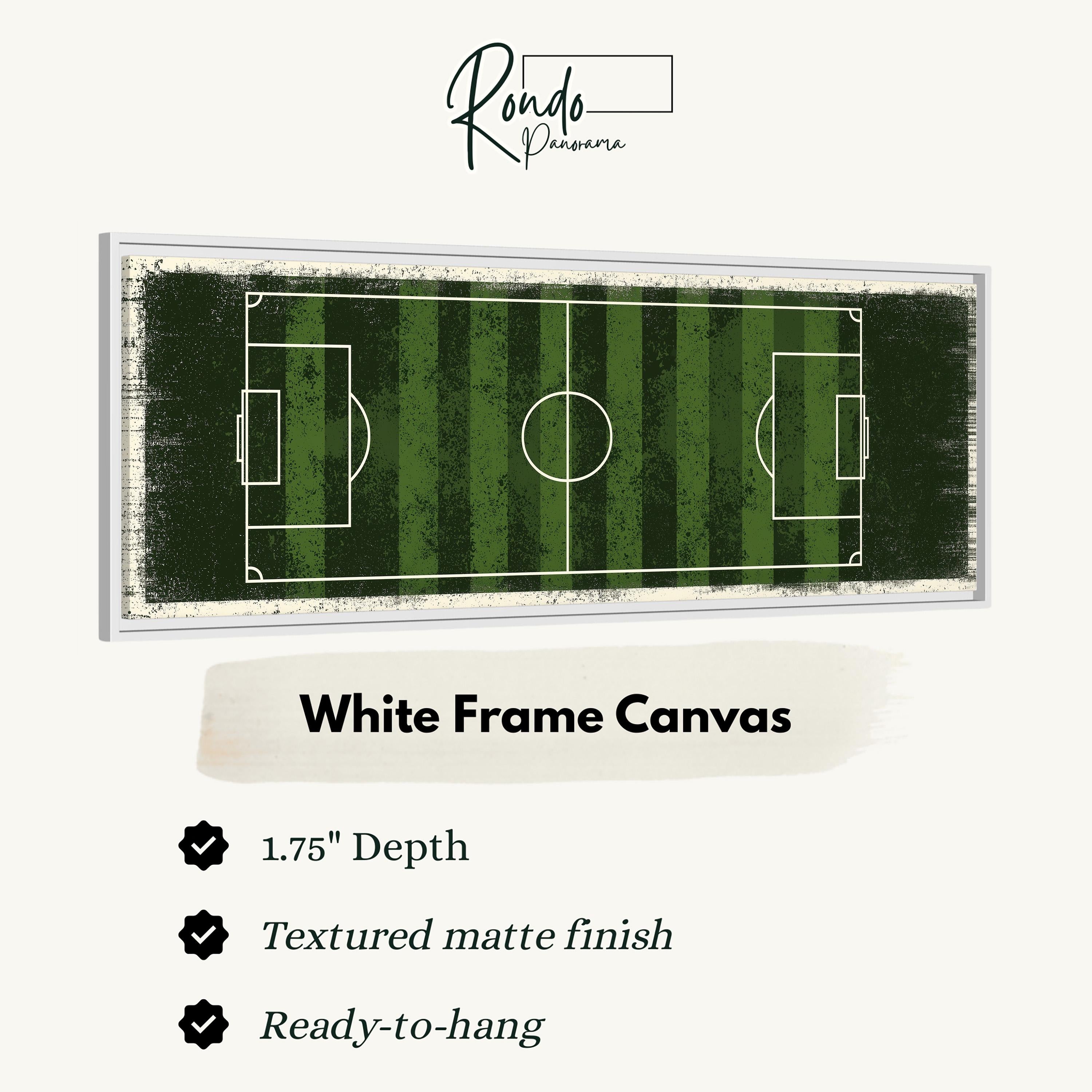 A framed canvas depicting a soccer field with a textured finish and a white frame.