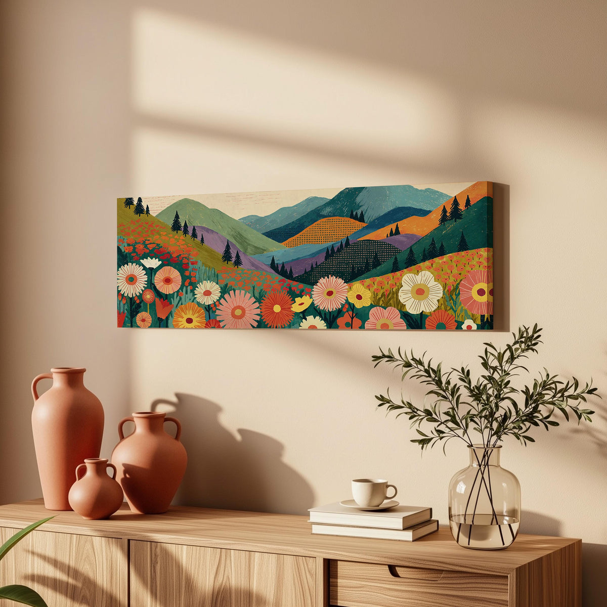 Wildflower valley below patterned mountains long horizontal canvas print above a wooden sideboard