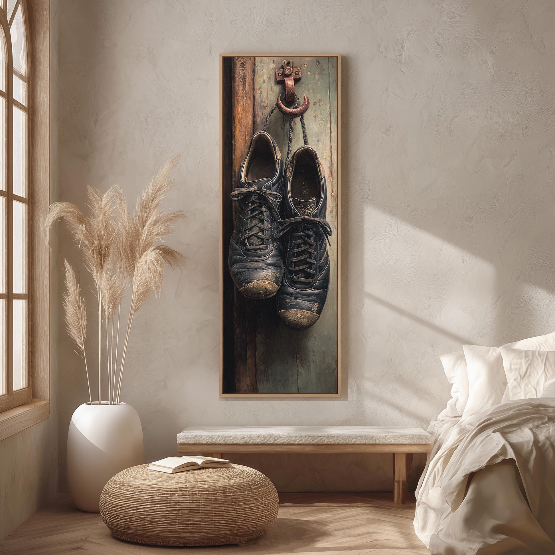 a pair of old, worn shoes hanging on a wooden door, with a pair of potted plants on either side of the door.