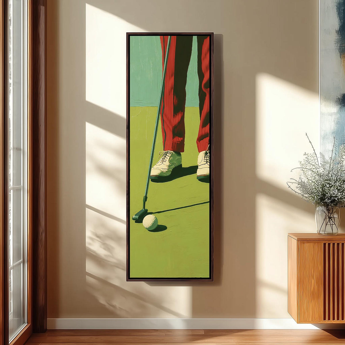 Golfer in red trousers lining up a putt long vertical canvas print in a sunlit living space