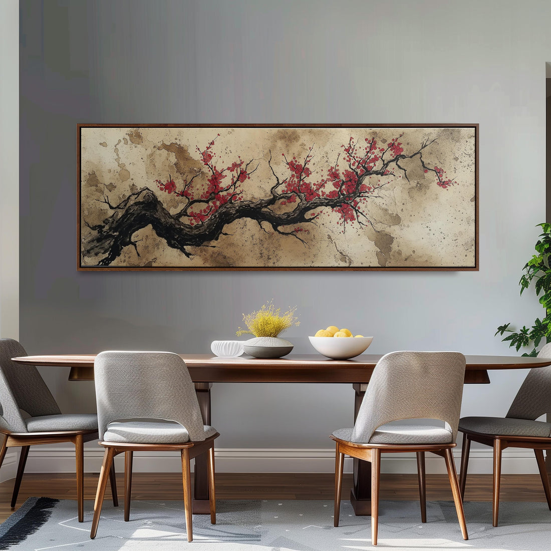 a large, framed painting of a tree branch with red flowers hanging above a brown sofa in a living room setting.