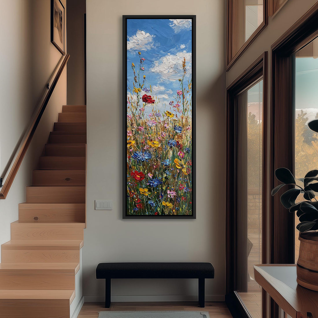 a large, colorful painting of a field of flowers hanging on a wall.