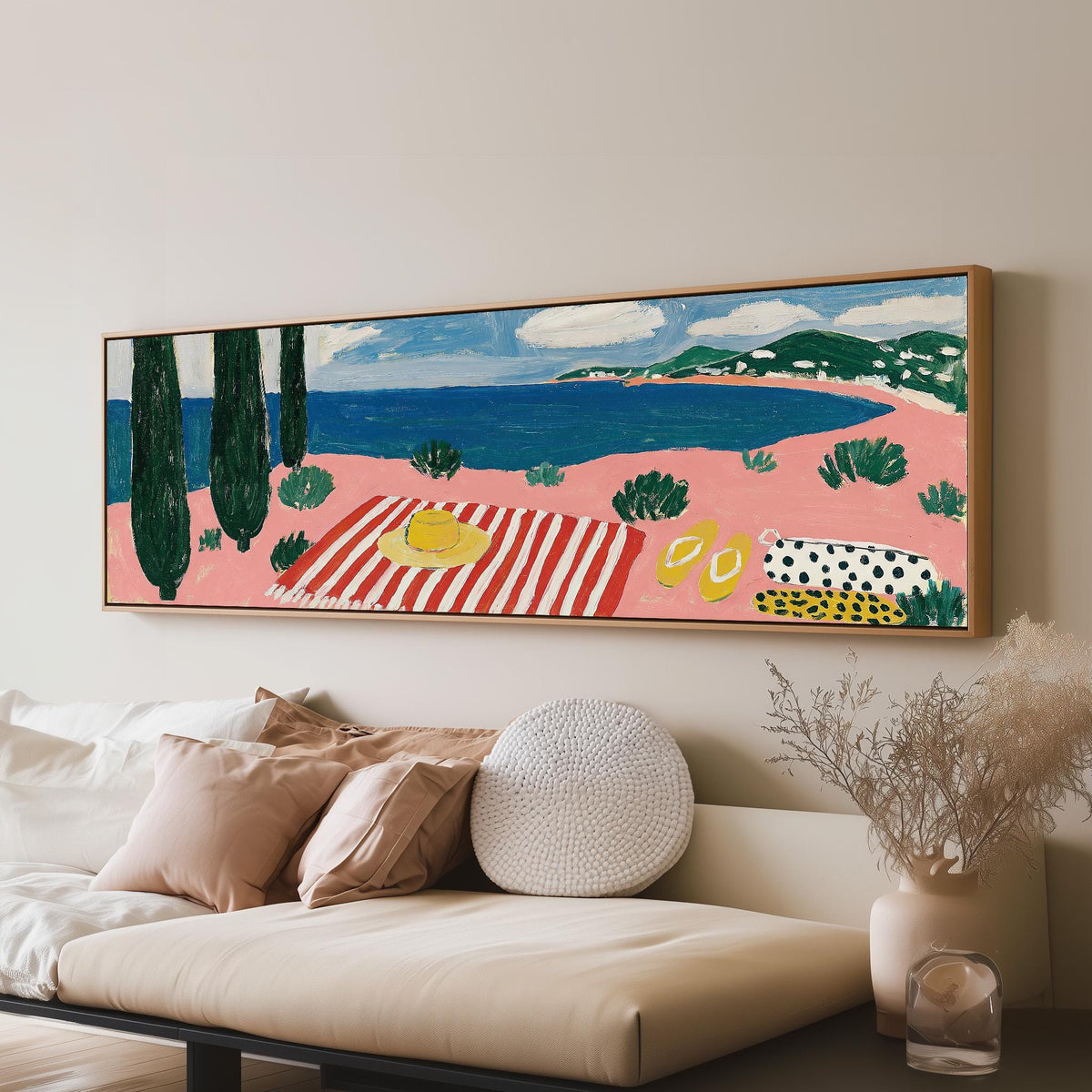 Mediterranean beach day with a striped towel panoramic canvas print above a sofa in a living room