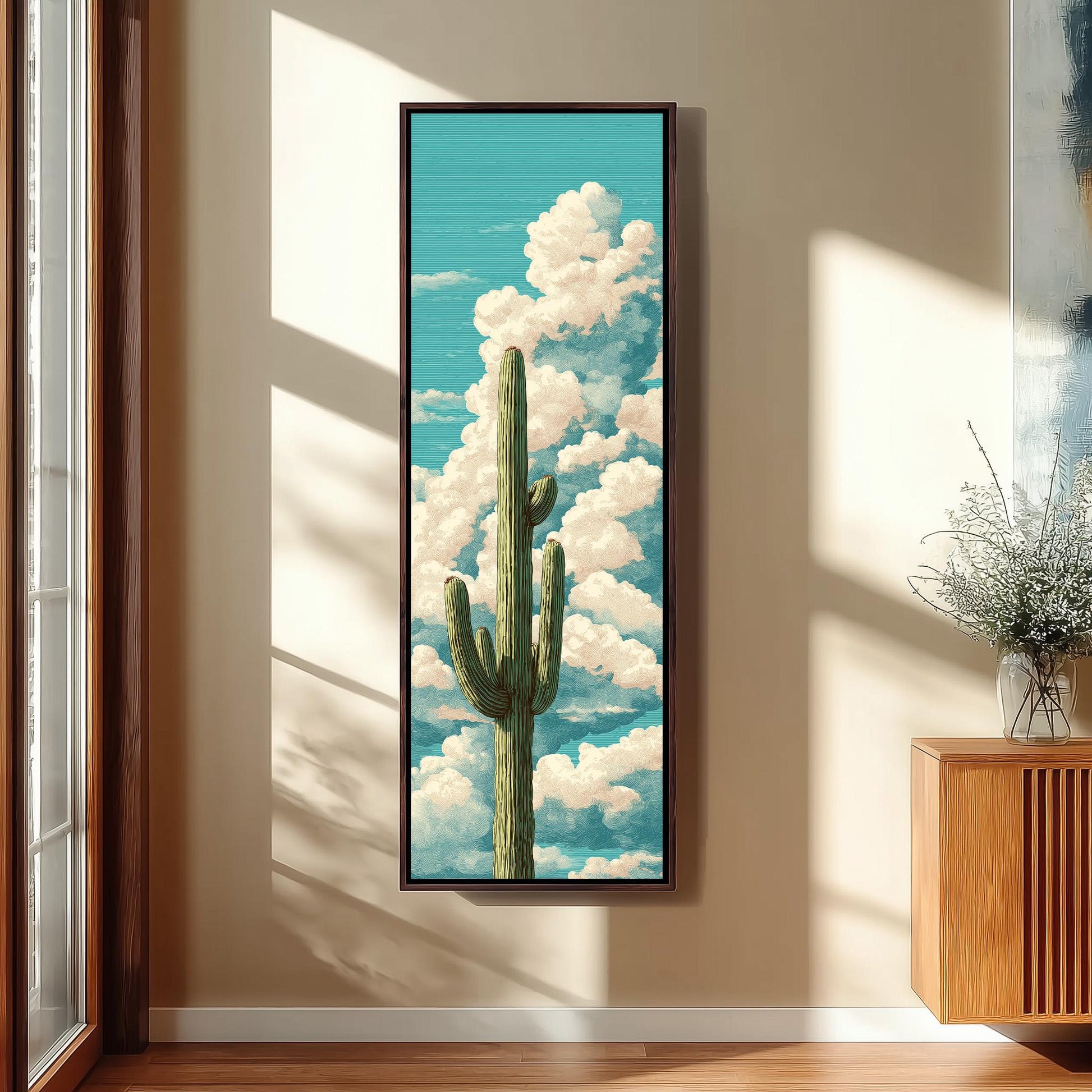 a framed painting of a cactus against a backdrop of a blue sky with fluffy white clouds.