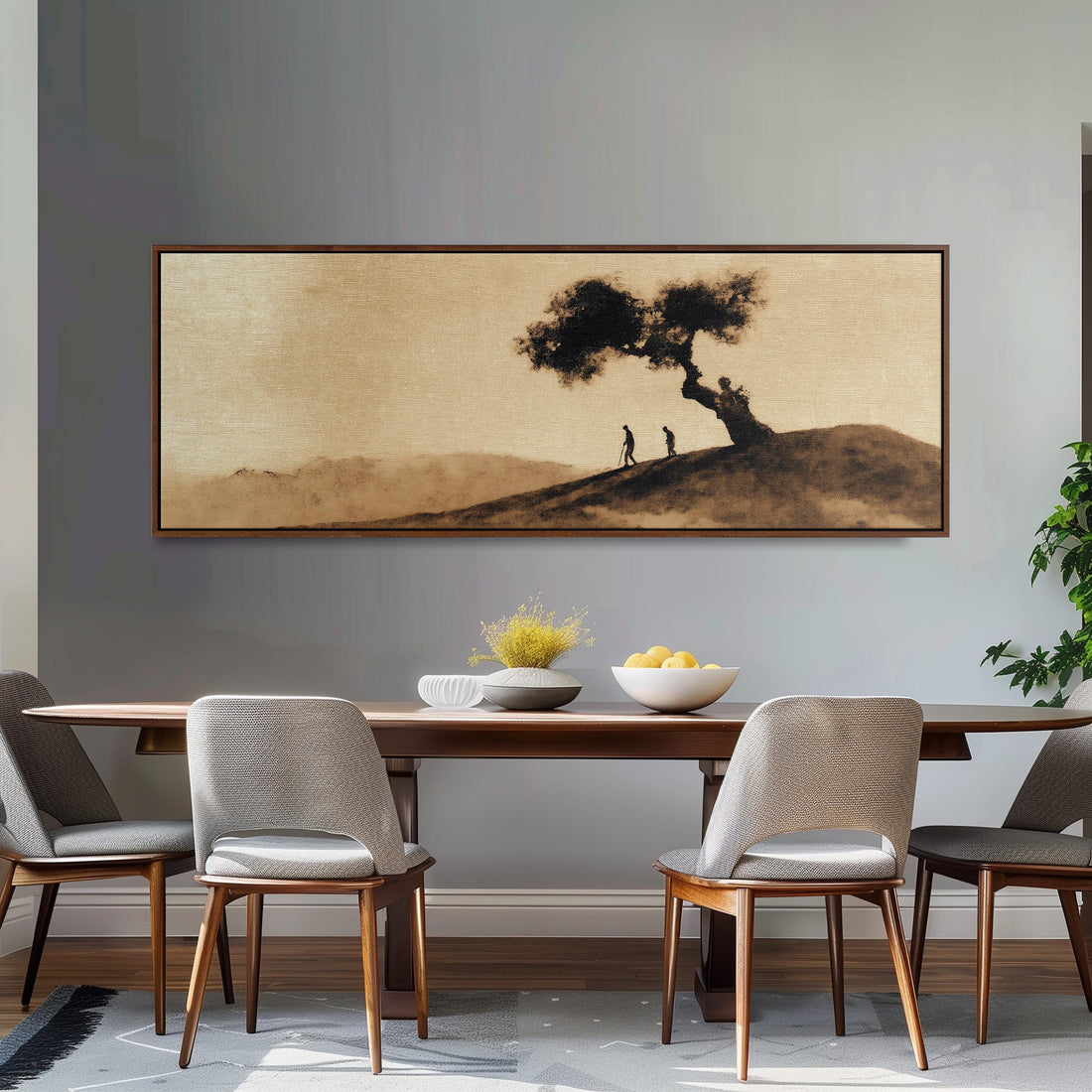 a large, framed painting of a tree and two people on a hill, hanging on a wall above a brown sofa.