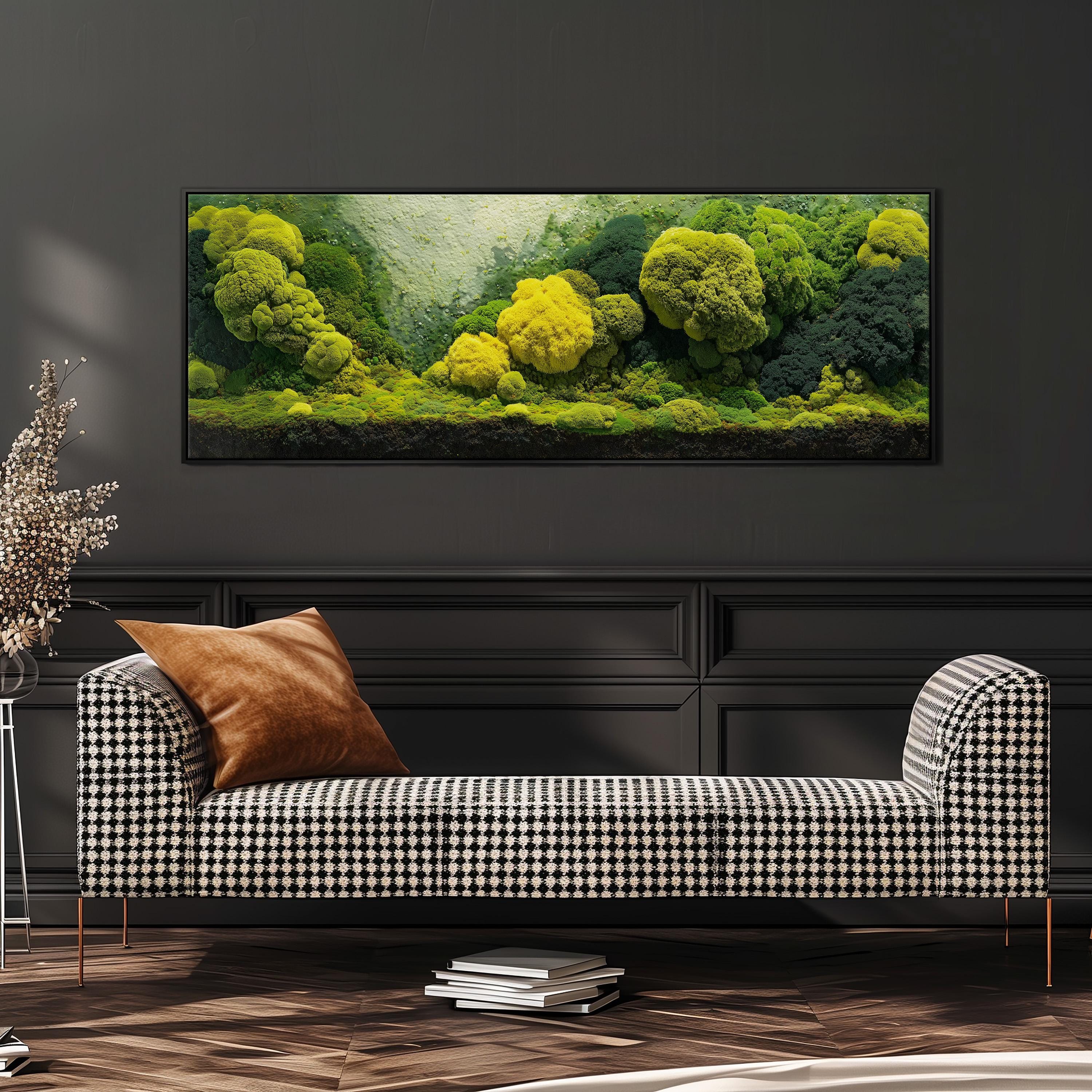a large, framed painting of a lush, verdant landscape with a variety of trees and foliage, hanging on a dark wall above a black and white checkered sofa.