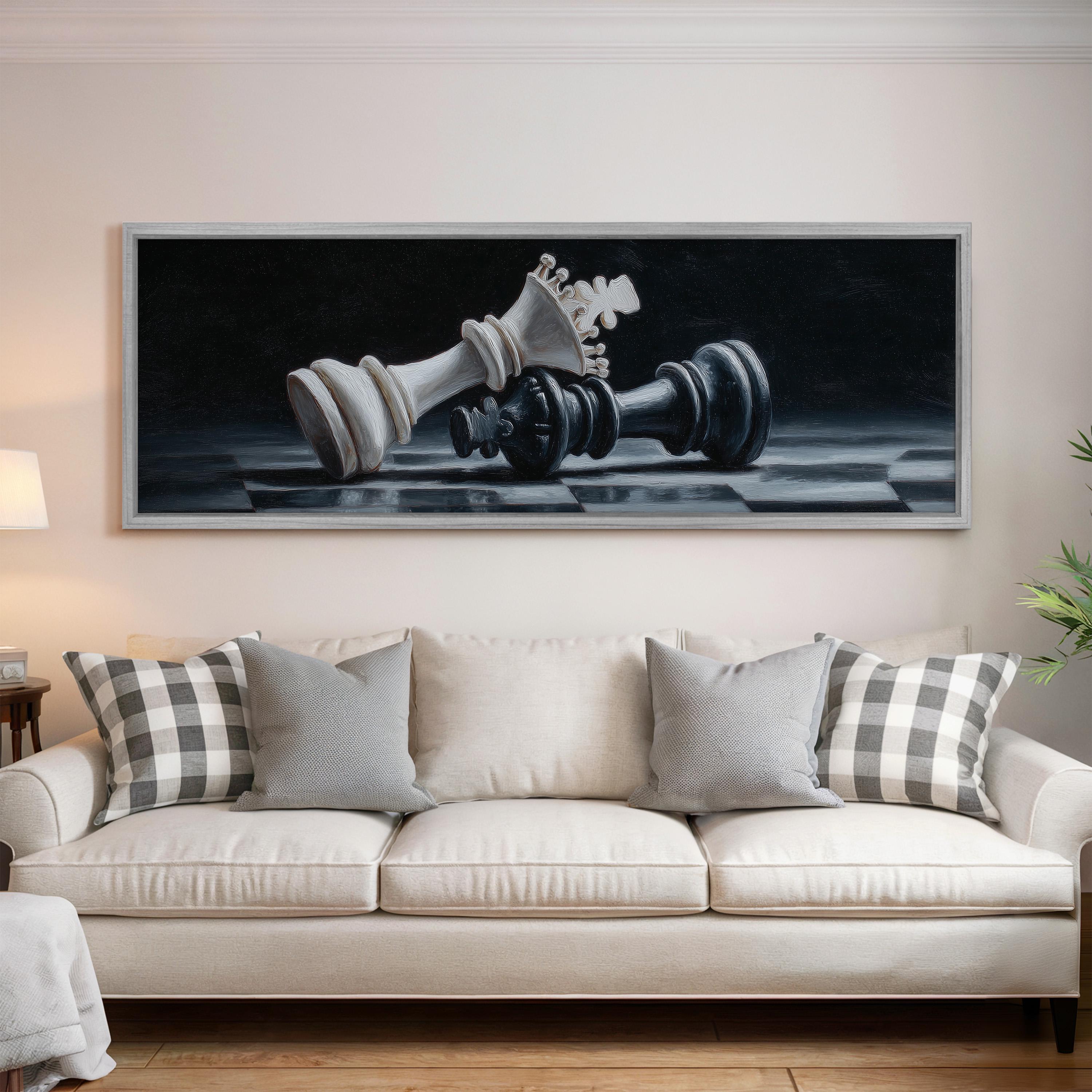 a large painting of a chess king and queen on a black and white checkered background, hanging on a wall above a white sofa with gray and white patterned pillows.
