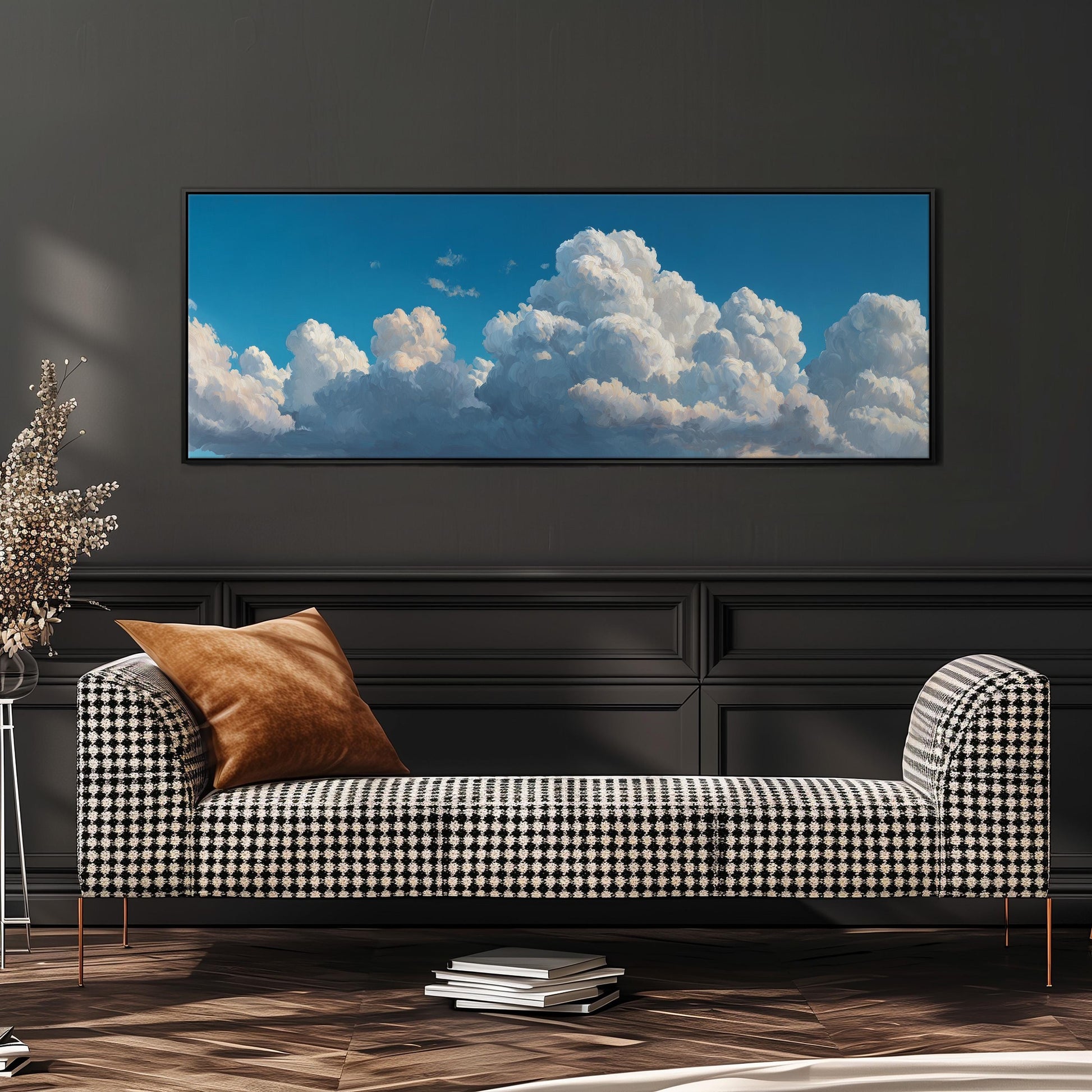 a large black and white checkered sofa with a brown throw pillow, set against a dark wall with a framed picture of a blue sky with fluffy white clouds hanging above it.