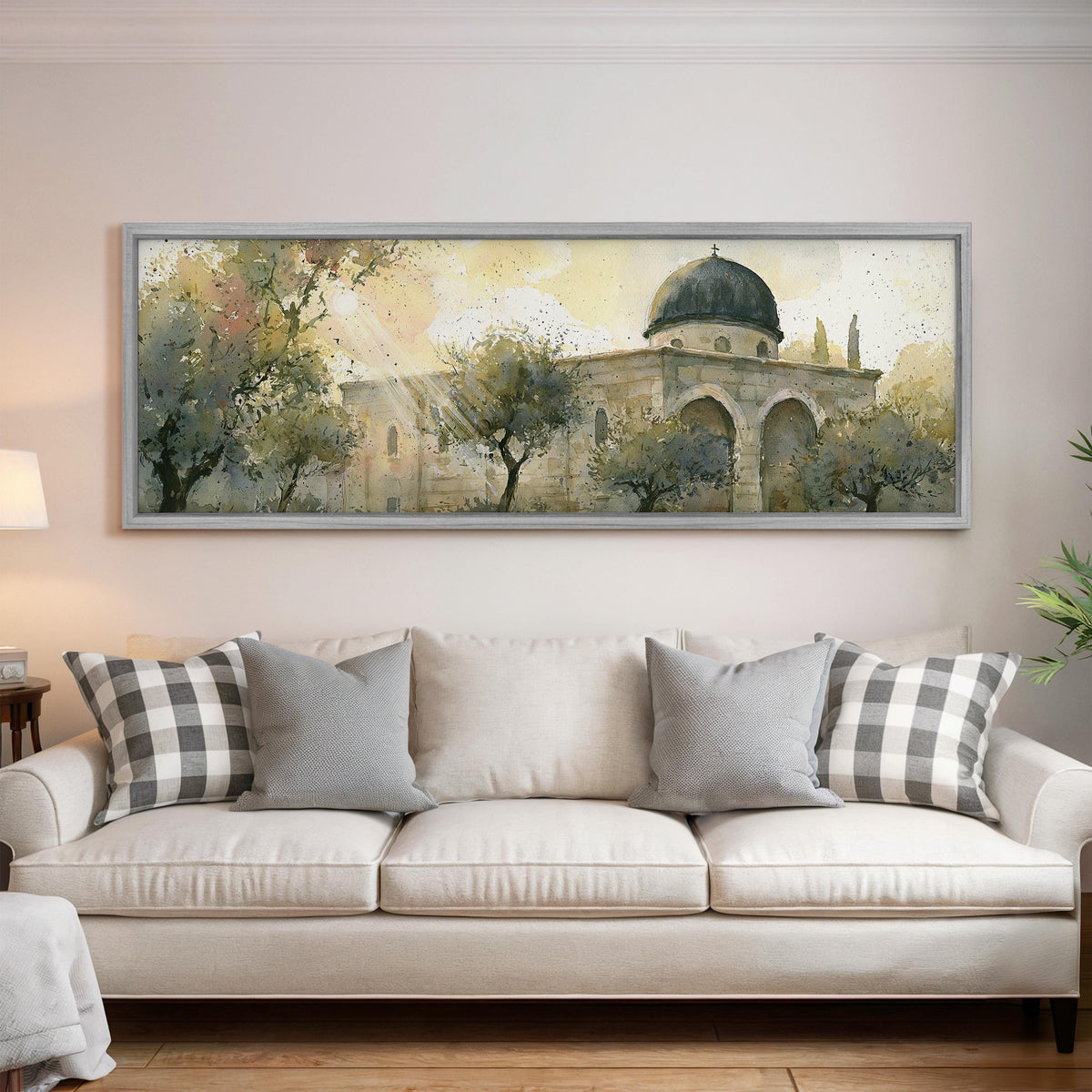 Sunlit dome in an olive grove panoramic canvas print above a white sofa in a bright living room