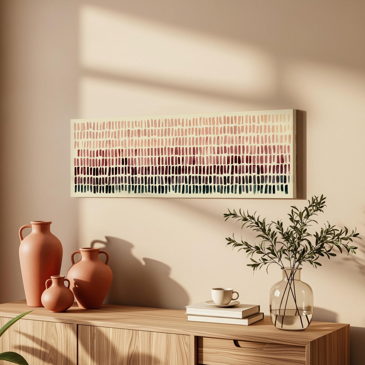 Brushmarks fading from blush to deep maroon long horizontal canvas print above a wooden sideboard