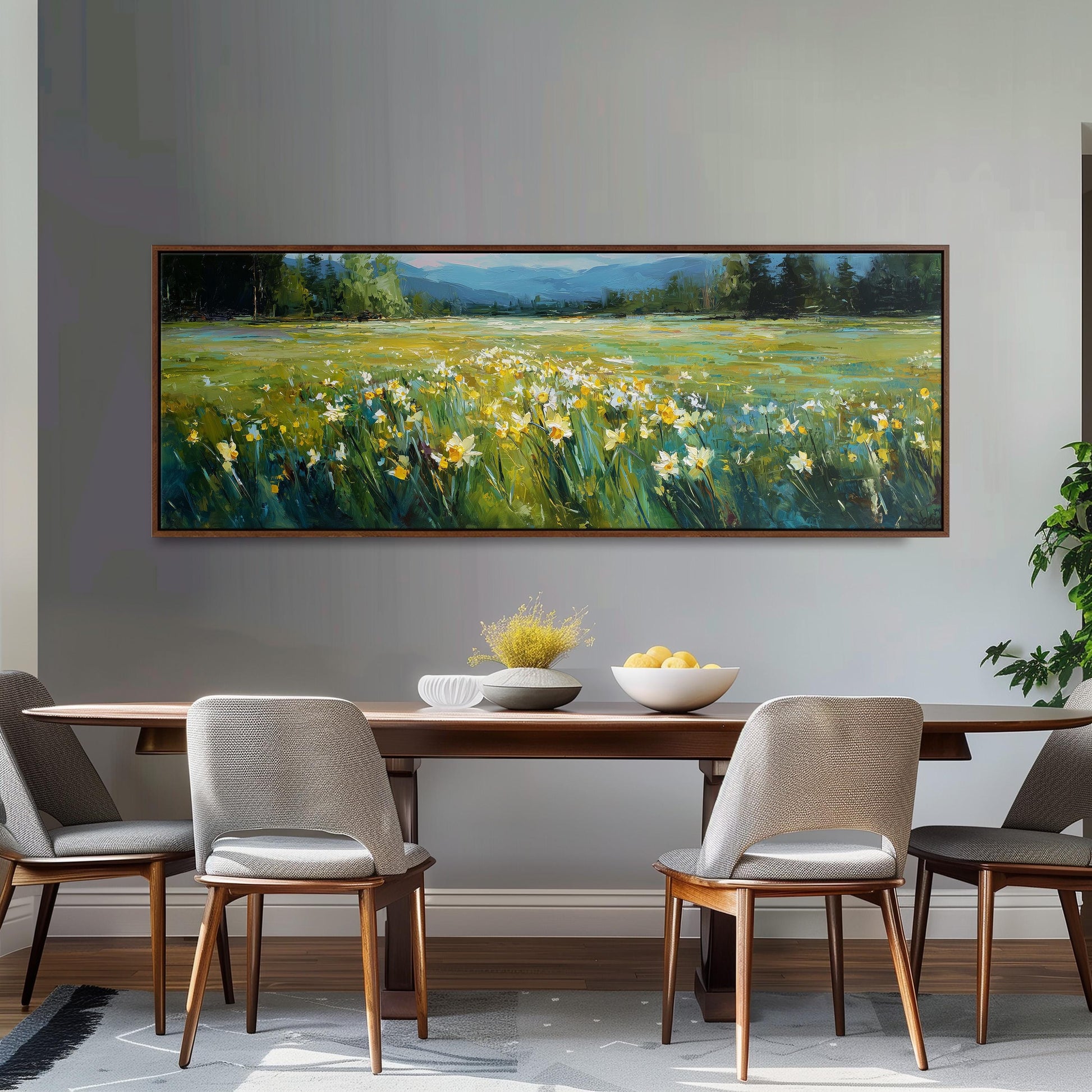 a large painting of a field with yellow flowers hanging on a wall above a wooden dining table with four chairs.