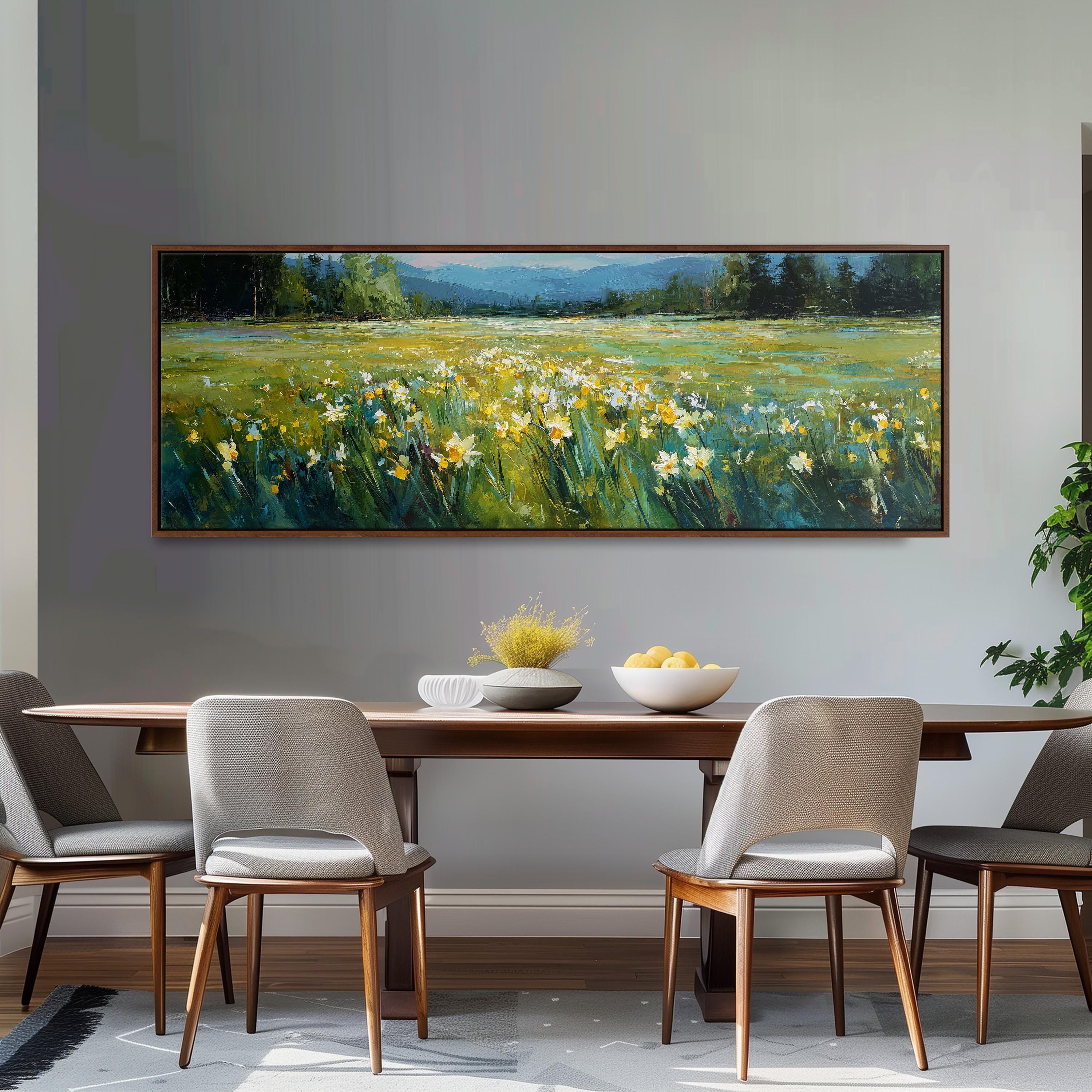 a large painting of a field with yellow flowers hanging on a wall above a wooden dining table with four chairs.