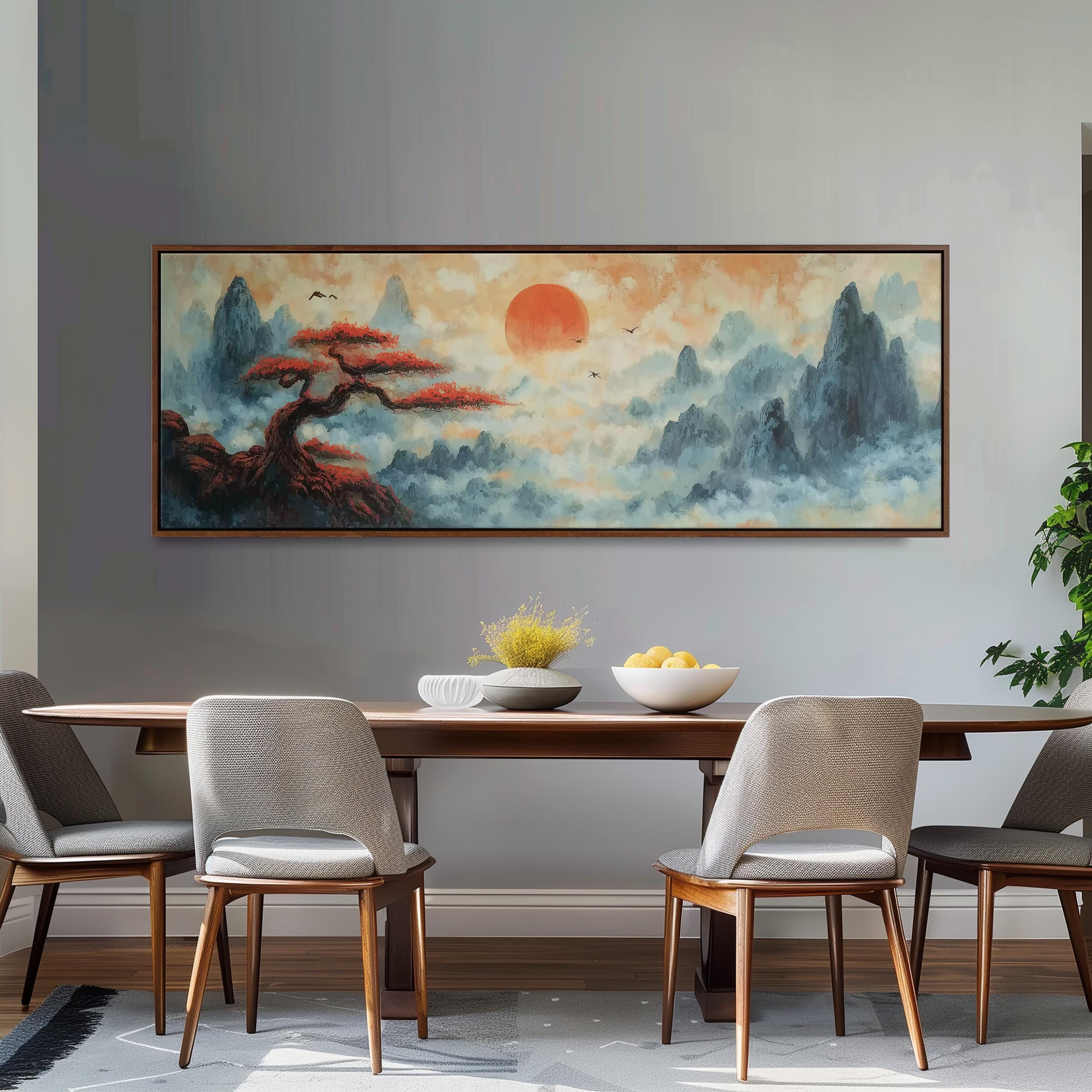 a dining room with a large painting of a landscape hanging on the wall above a wooden table with four chairs. The painting depicts a serene mountain landscape with a tree and a sun in the sky.