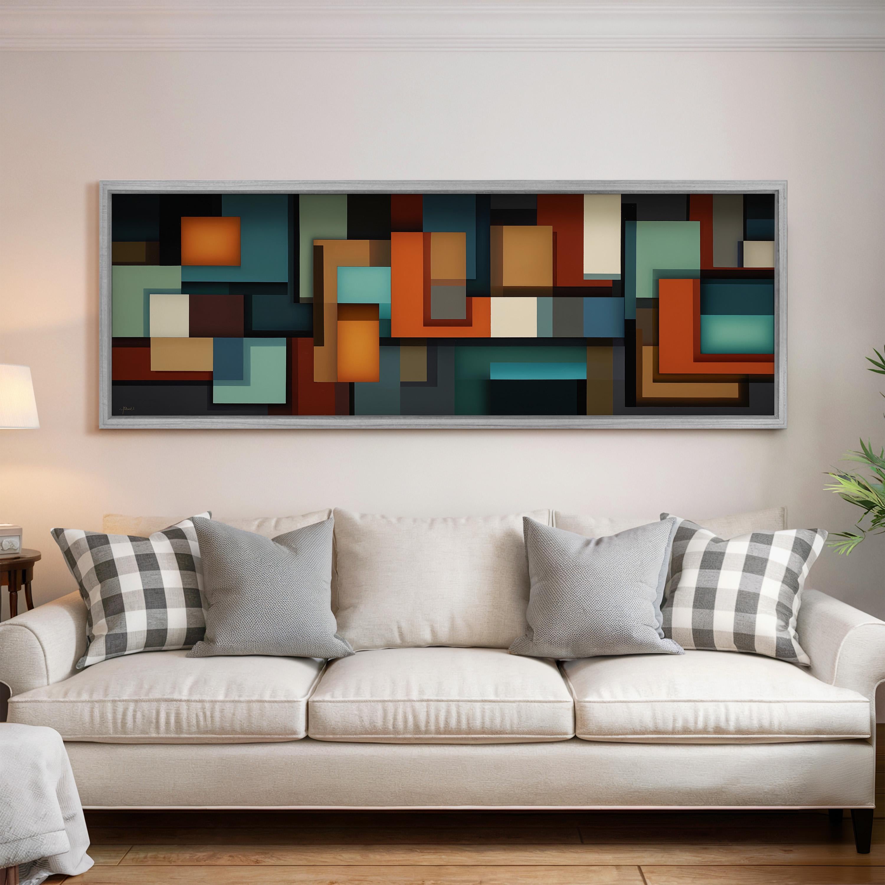 a large abstract painting hanging on a wall above a white couch with gray and white patterned pillows.