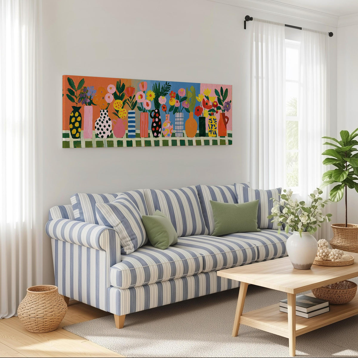 Patterned vases with bright bouquets long horizontal canvas print above a striped sofa in a coastal living room