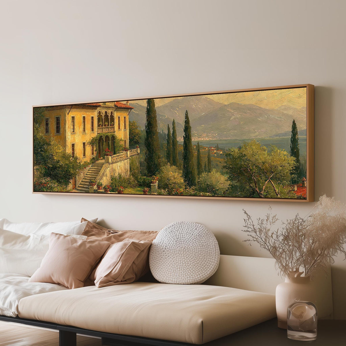 Tuscan villa among cypress hills panoramic canvas print above a sofa in a living room