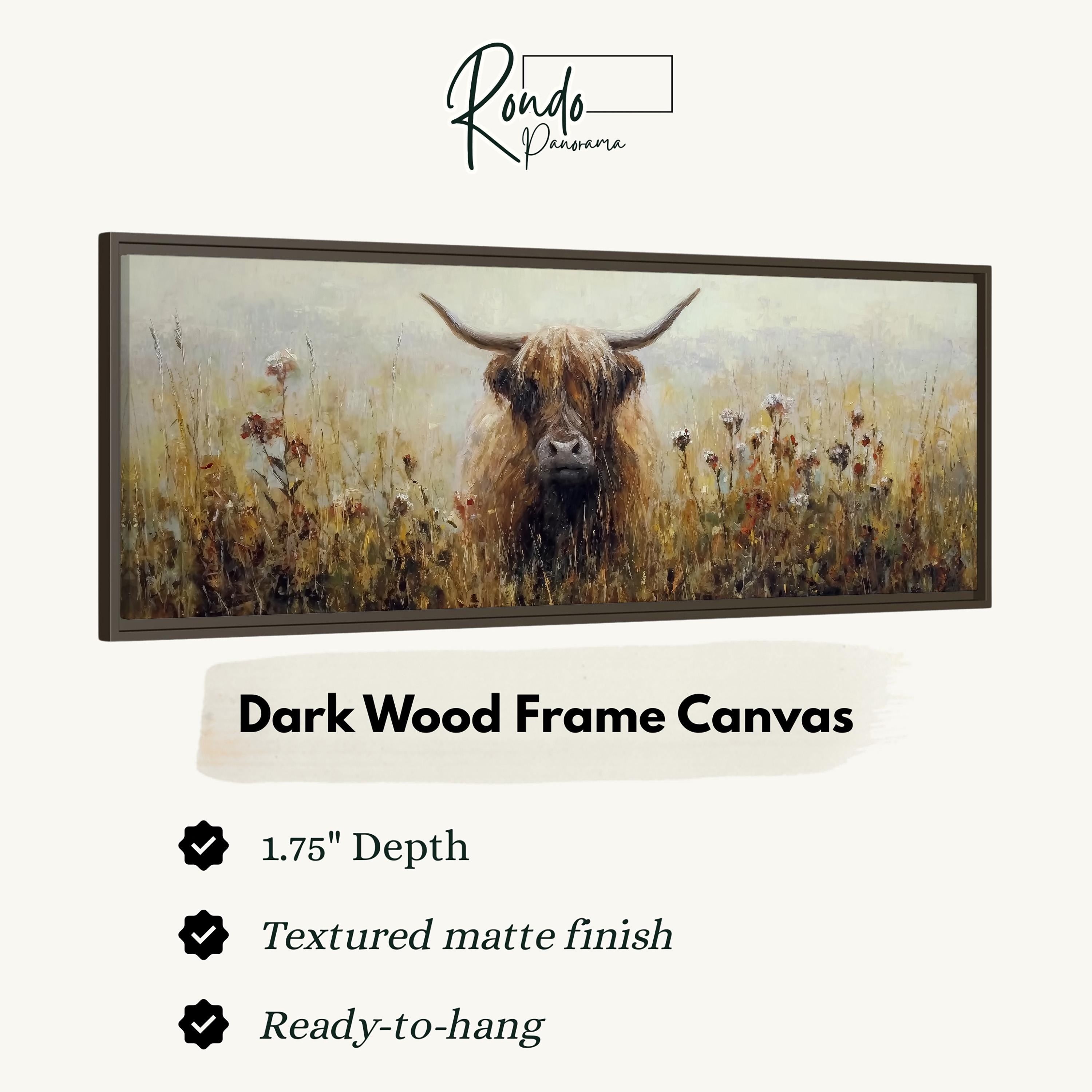 The image is a painting of a horned animal, likely a yak or a similar creature, standing in a field of tall grass. The painting is framed in a dark wood frame and is described as a canvas with a 1.75" depth, a textured matte finish, and a ready-to-hang condition.