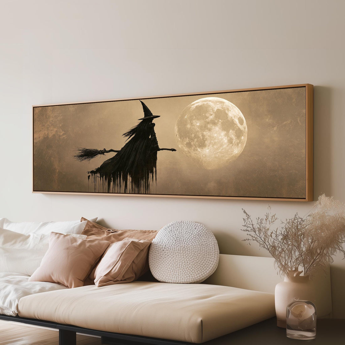 Witch on a broomstick before a full moon long horizontal canvas print above a sofa in a living room