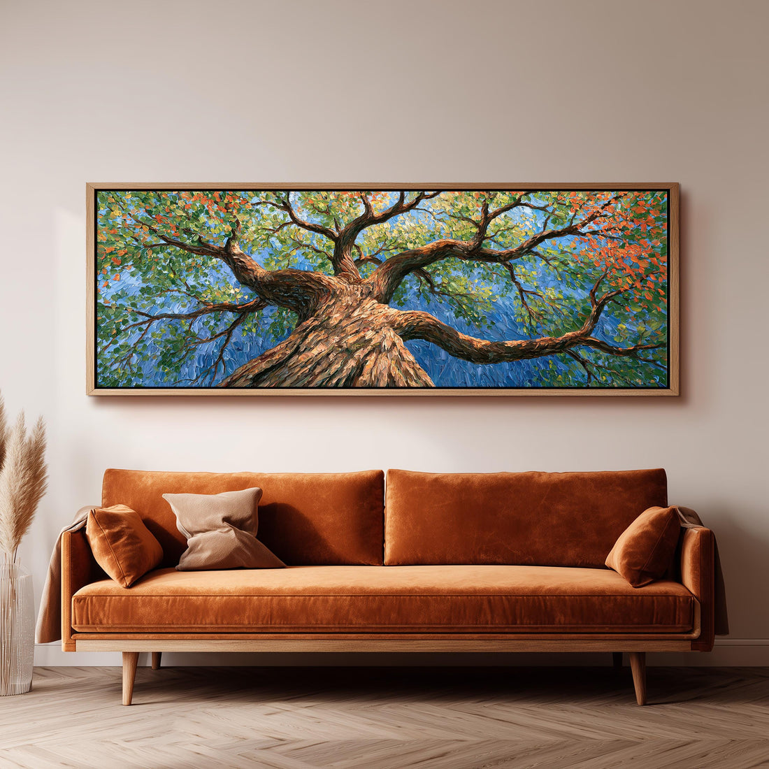 Vivid autumn tree canopy from below long horizontal canvas print above a sofa in a living room
