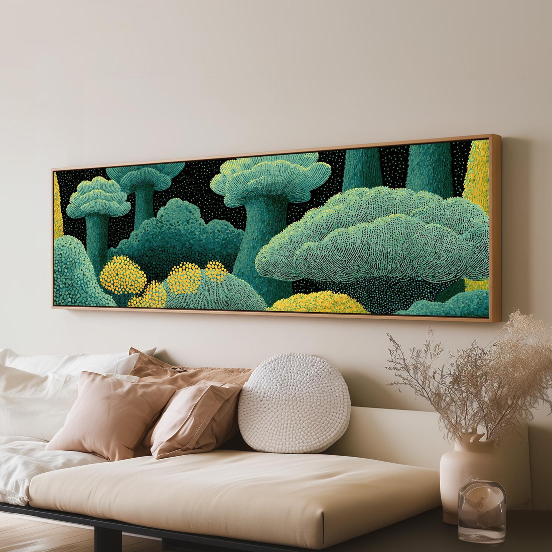 Teal dotted treetops long horizontal canvas print above a sofa in a living room