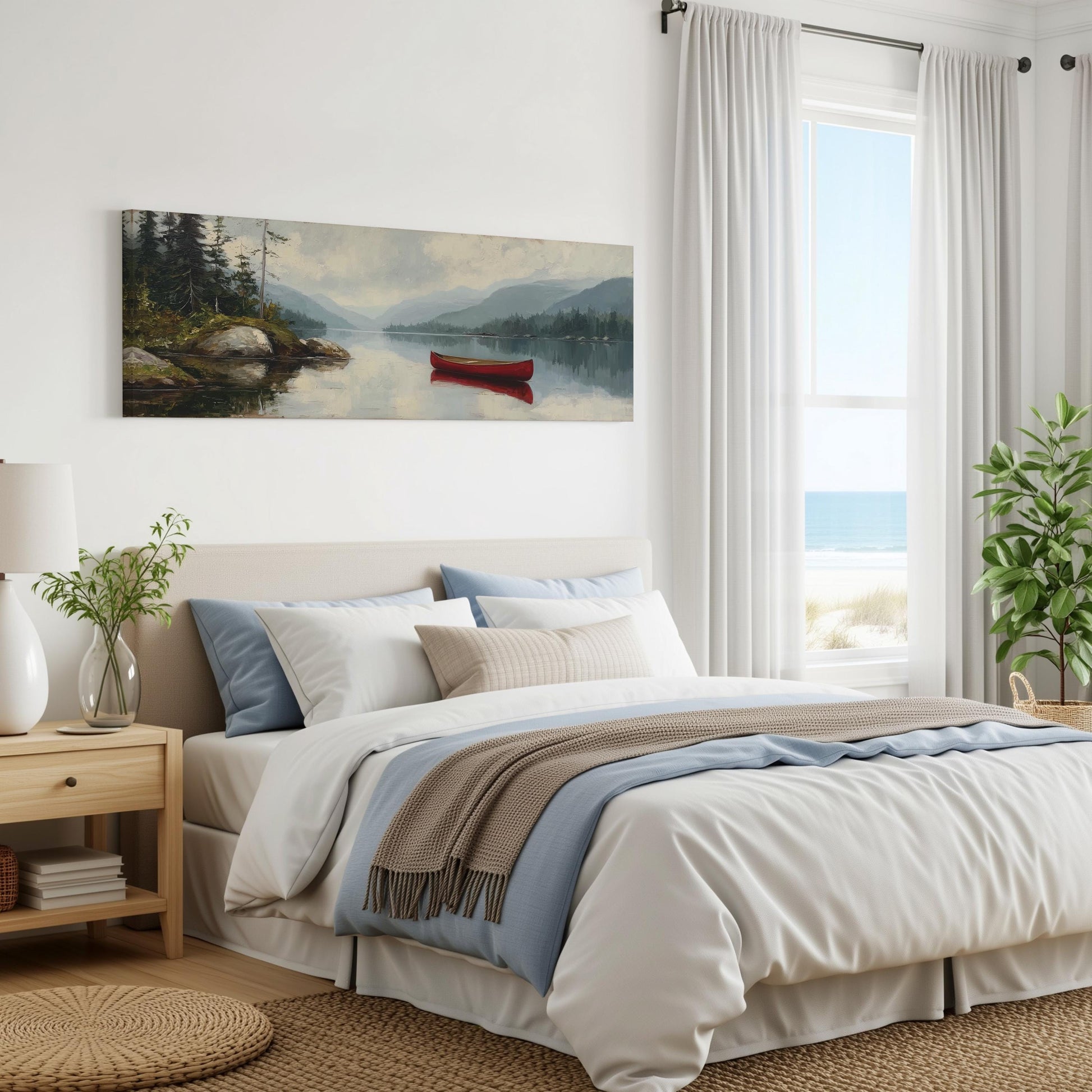 a serene bedroom with a large bed, a painting of a red canoe on a lake, and a window overlooking the ocean.