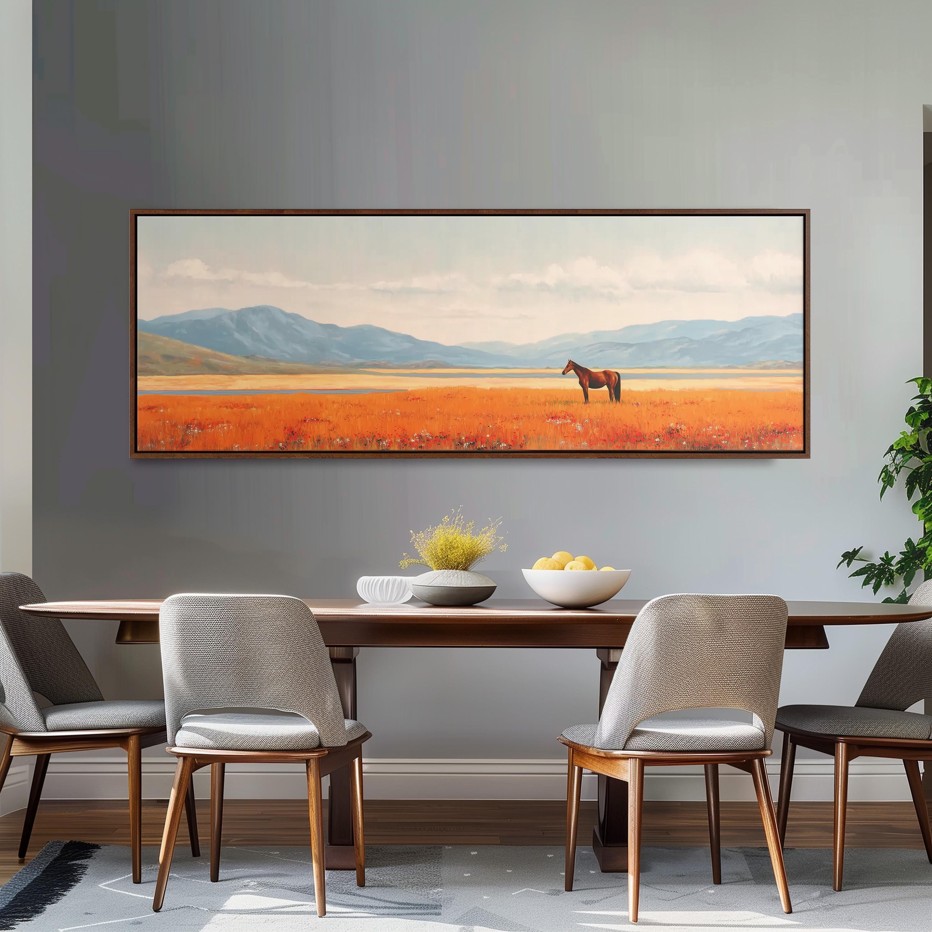 a large painting of a horse in a field, hanging on a wall above a wooden dining table with four chairs.
