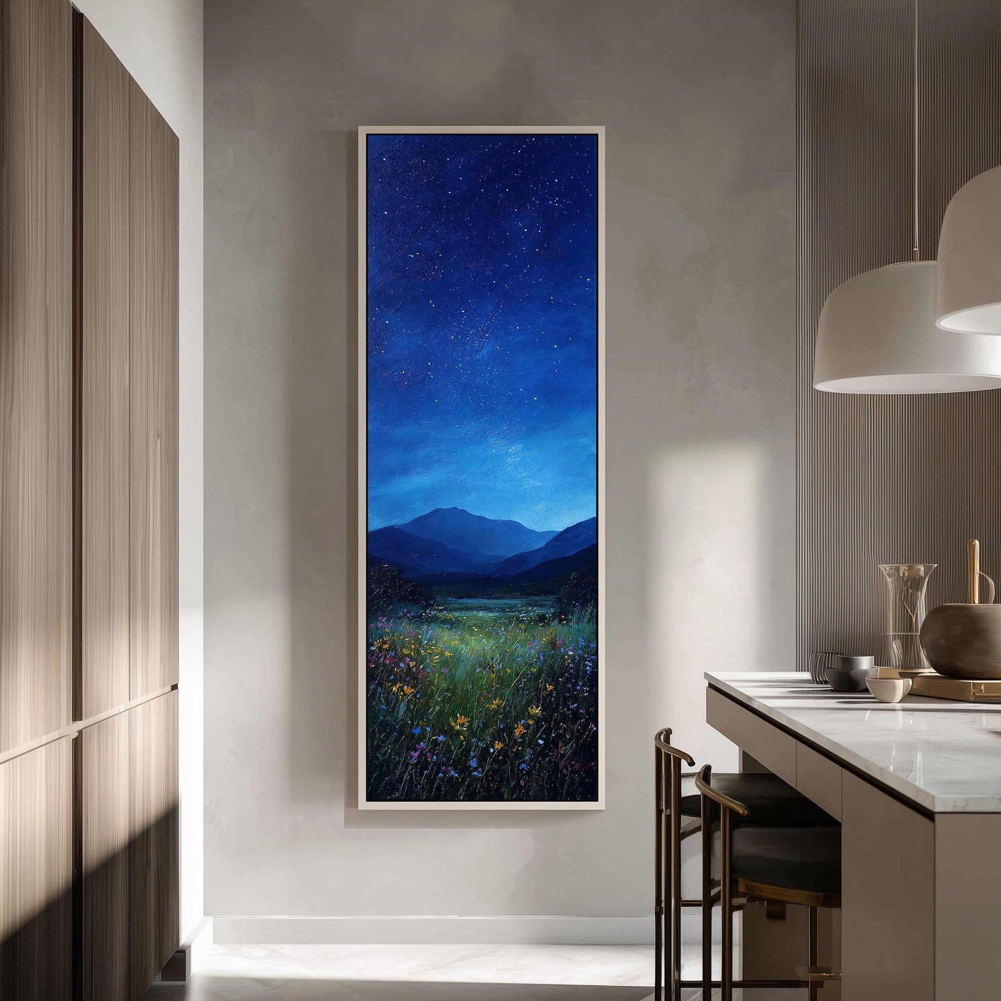 a large, framed painting of a night sky with stars and a field of flowers, hanging on a wall in a modern kitchen.