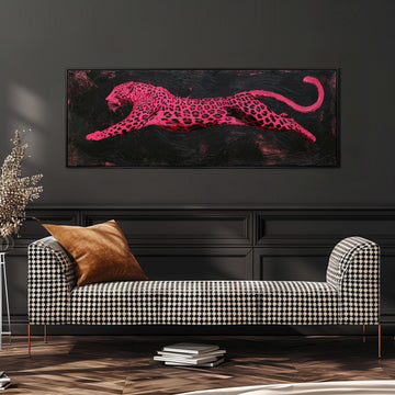 Pink leaping leopard long horizontal canvas print above a sofa in a living room
