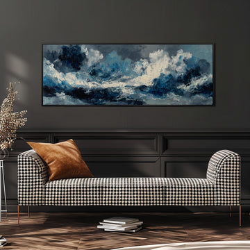 a large, rectangular painting of a stormy sea hanging on a dark wall above a black and white checkered sofa with a brown throw pillow.