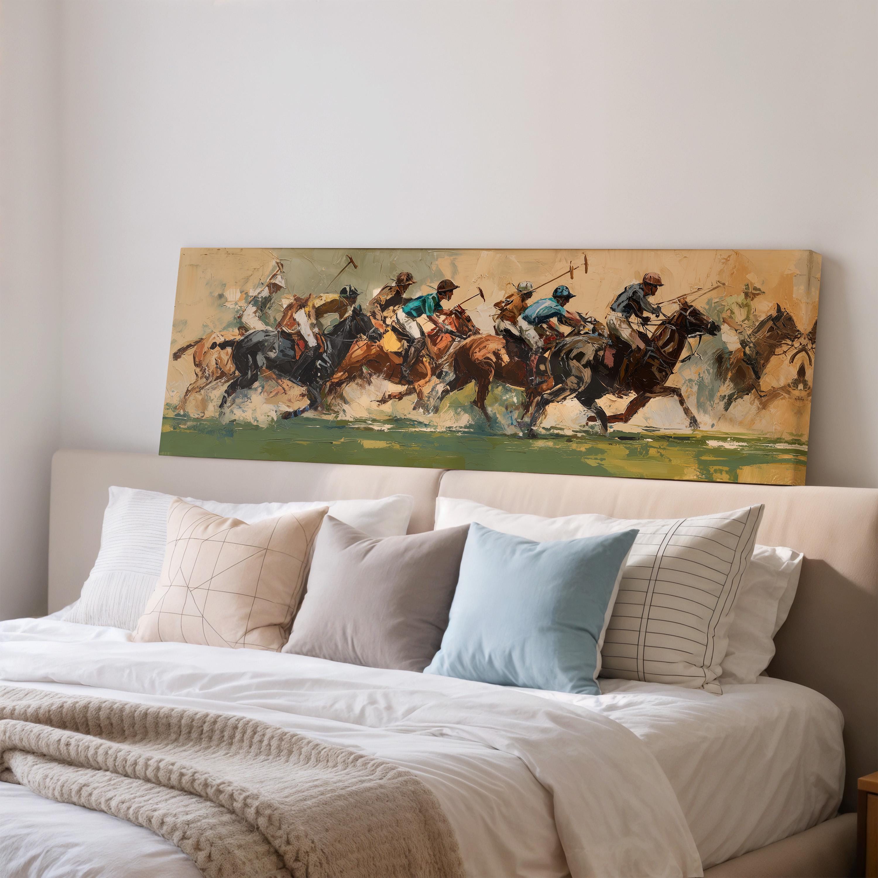 a large painting of a horse race on a wall above a bed with white pillows and a gray blanket.