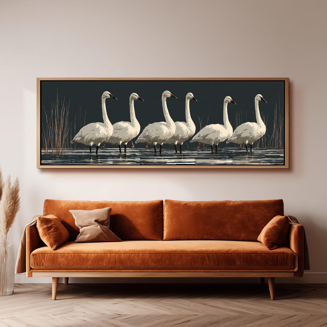 White swans reflected on a dark lake long horizontal canvas print above a sofa in a living room