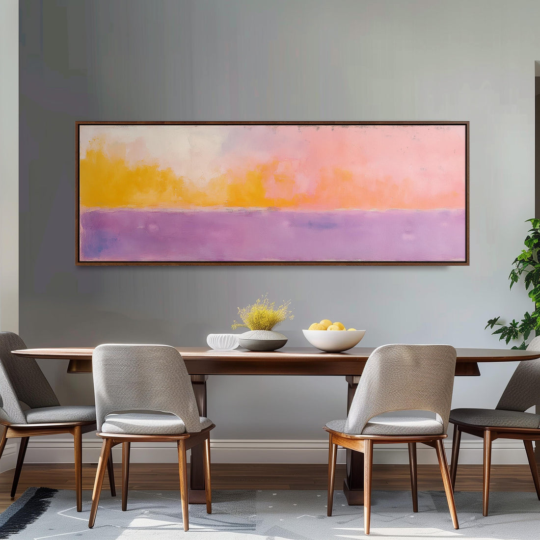 a cozy bedroom with a large bed adorned with white linens and a variety of colorful pillows. Above the bed, there is a large painting or artwork featuring a vibrant color palette of pink, orange, and purple.